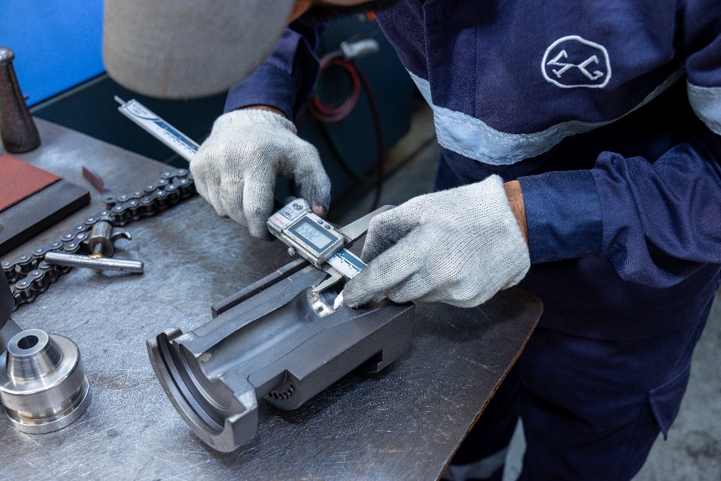 SAGCO technician measuring precision tooling for glass decoration